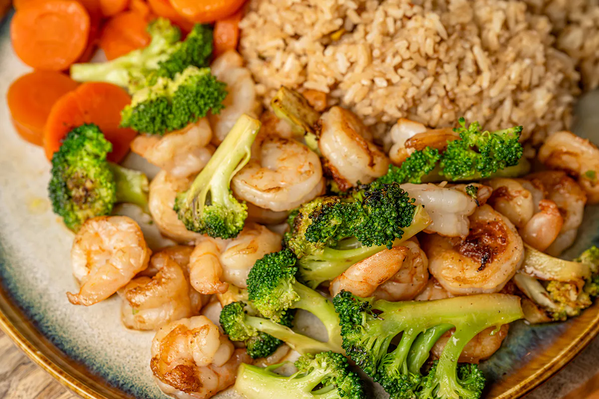 Hibachi shrimp with broccoli carrots and fried rice